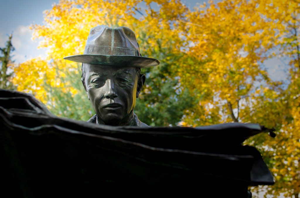 Seward Johnson's mystery “Newspaper Reader” located at Princeton's Battle Monument park., read