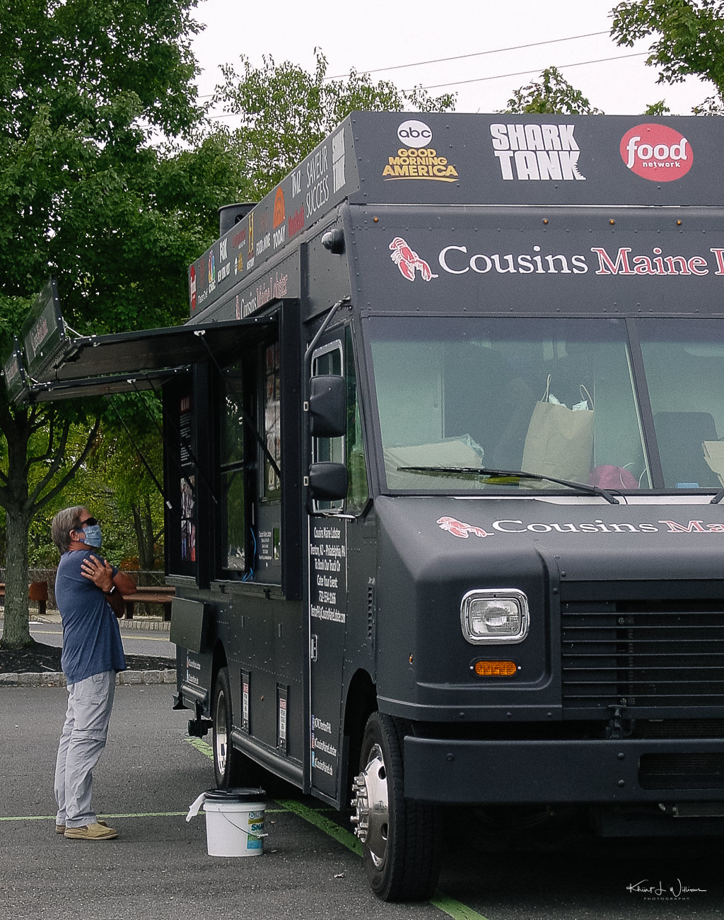 Cousins Maine Lobster food truck with customer