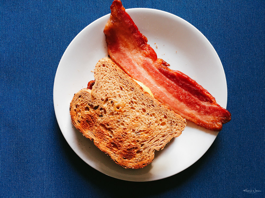 bacon and toast on plate