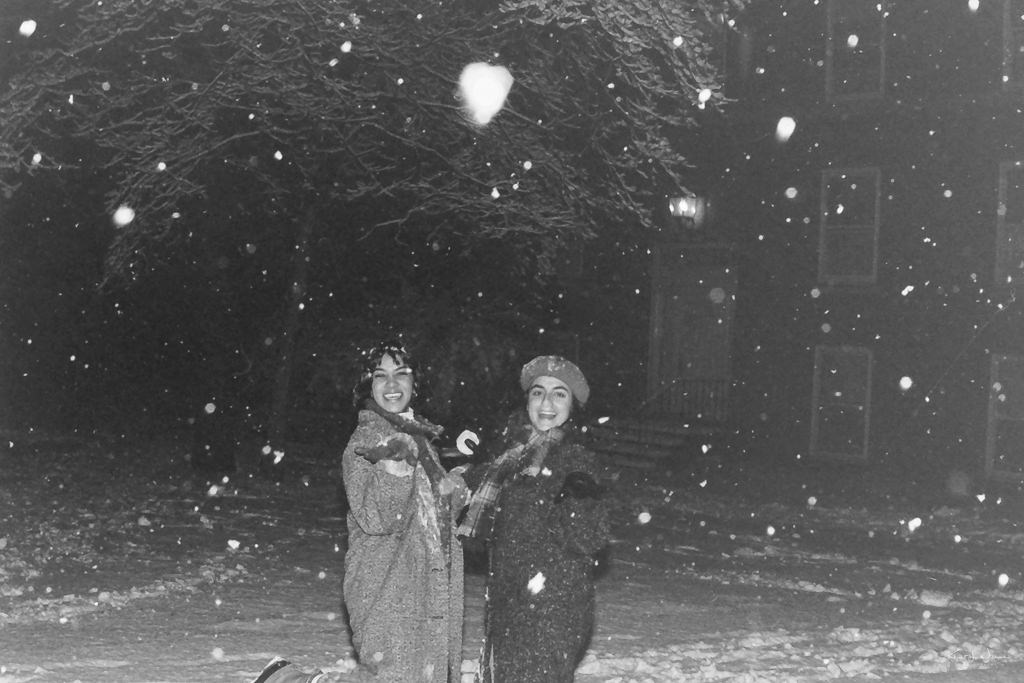 two women playing in snow