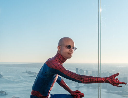 Man posing in Spider-Man costume.