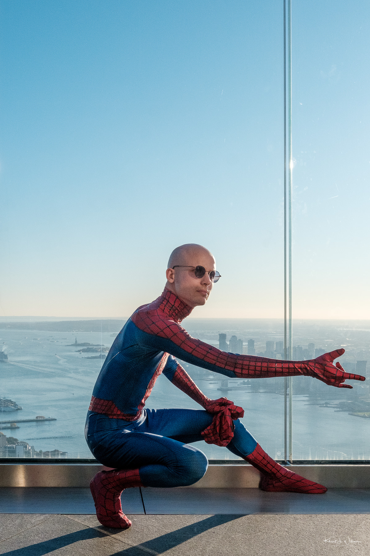 Man posing in Spider-Man costume.